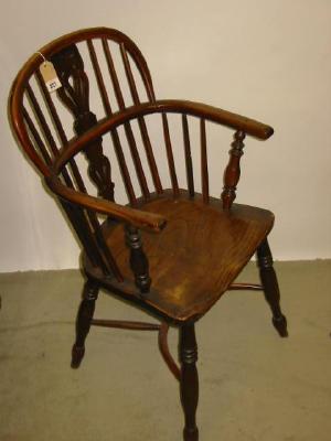 Appraisal: A YEW WINDSOR ARM CHAIR similar to the previous lot