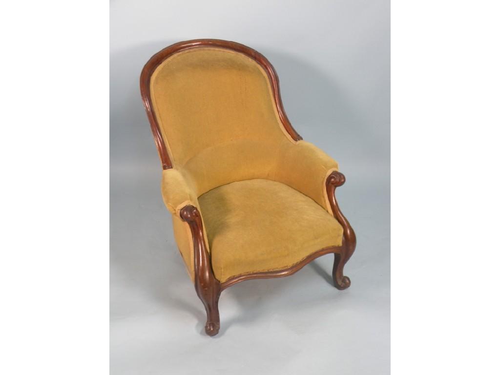 Appraisal: A Victorian mahogany spoon back armchair with show-frame upholstered in