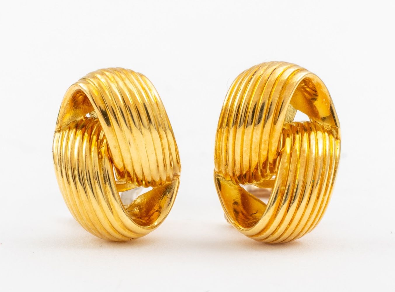 Appraisal: ITALIAN K YELLOW GOLD TWISTED KNOT EARRINGS K yellow gold