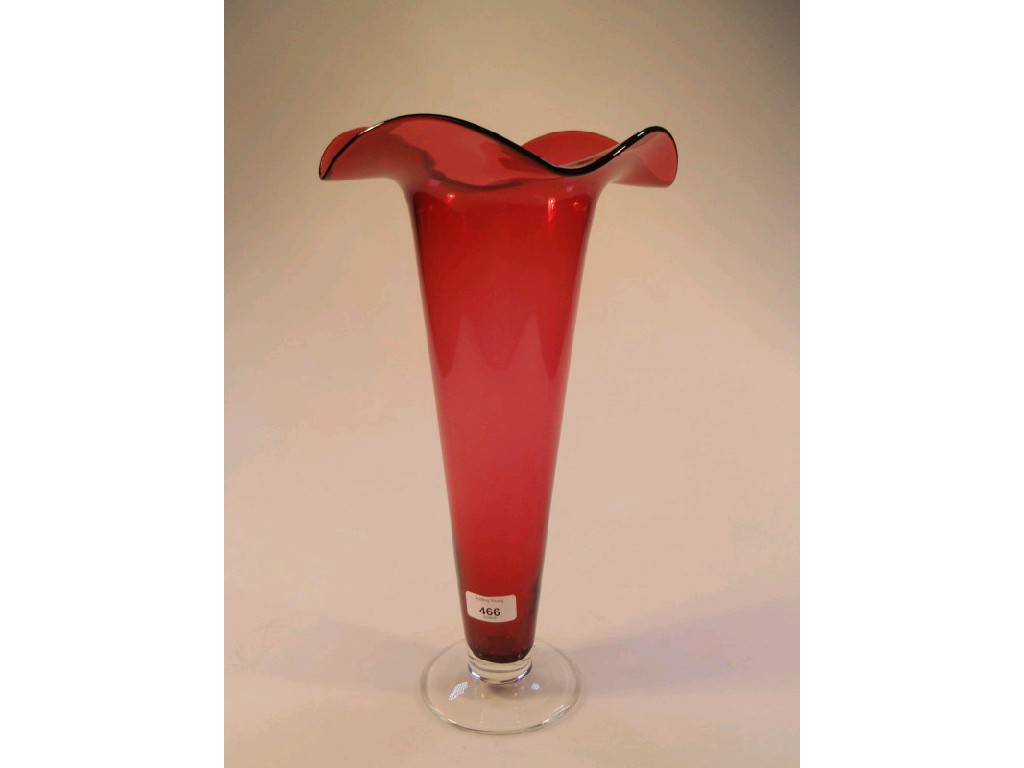 Appraisal: A cased cranberry glass lily vase with an undulating everted