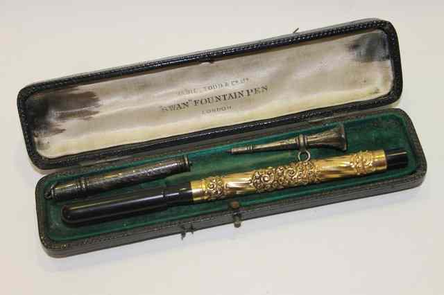 Appraisal: A SWAN FOUNTAIN PEN with embossed gilt mount stamped Swan