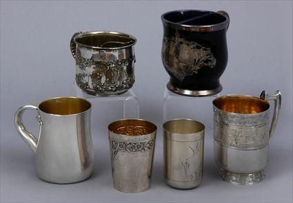 Appraisal: FOUR MUGS AND TWO SILVER CUPSComprising a monogrammed silver-mounted cobalt-glazed