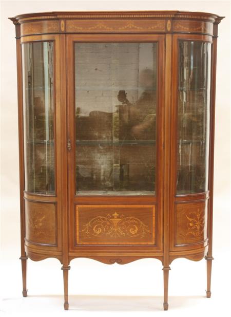 Appraisal: An Edwardian mahogany inlaid cabinet with moulded projected cornice over