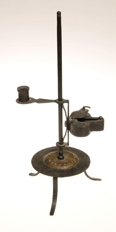 Appraisal: WROUGHT-IRON AND BRASS RUSHNIP CANDLEHOLDER in th century style raised