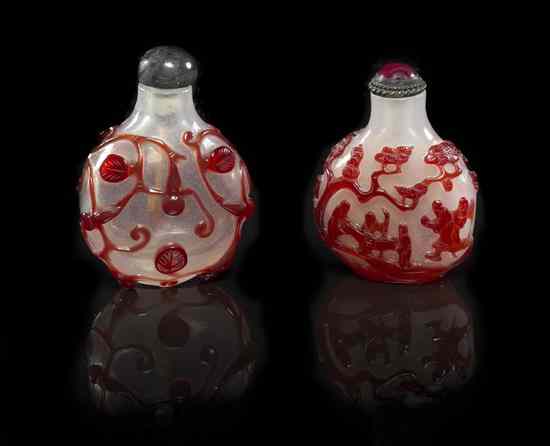 Appraisal: Two Glass Overlay Snuff Bottles having white reserves with red