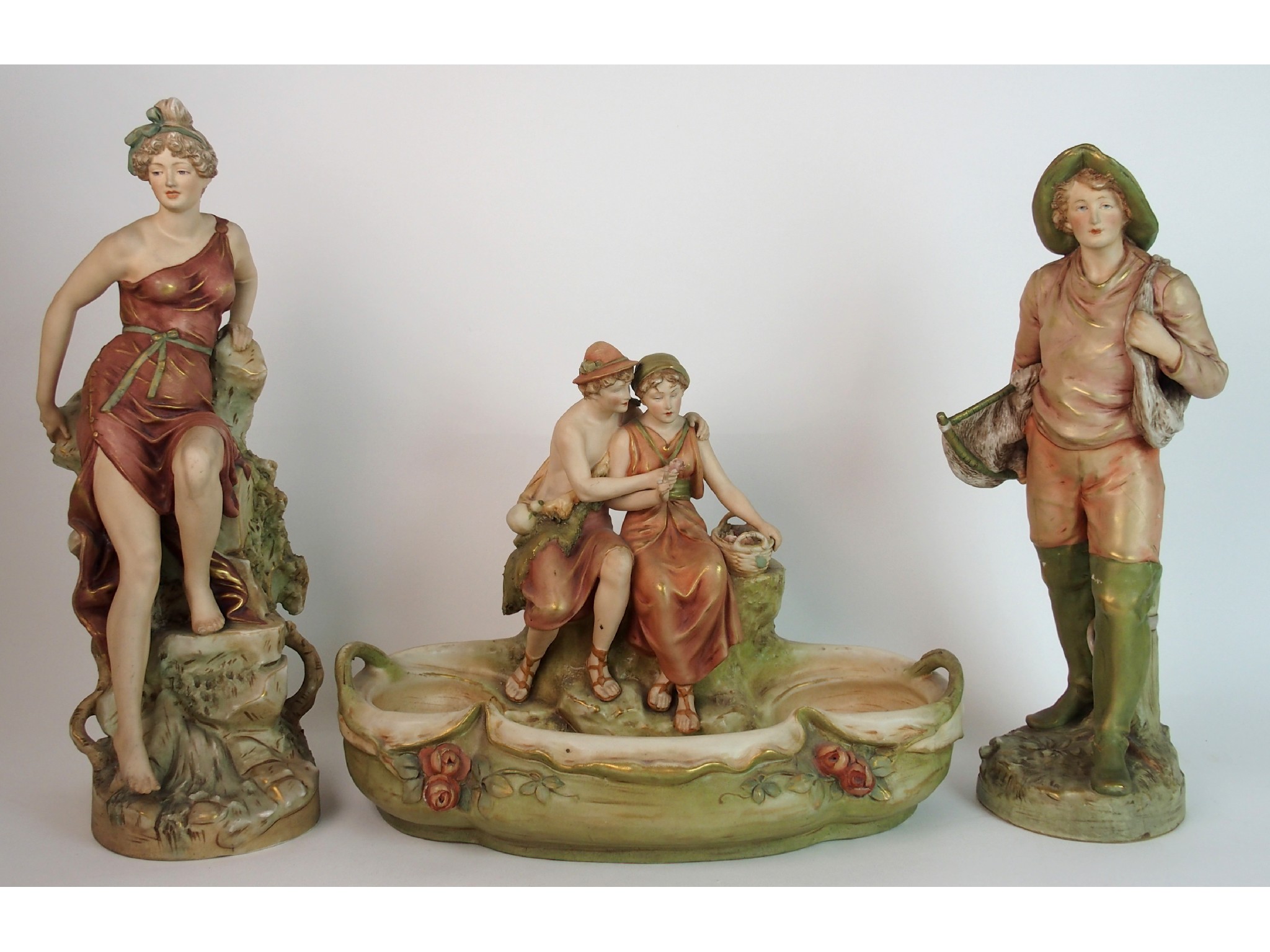 Appraisal: A Royal Dux table centrepiece figure groupdepicting a goat herder