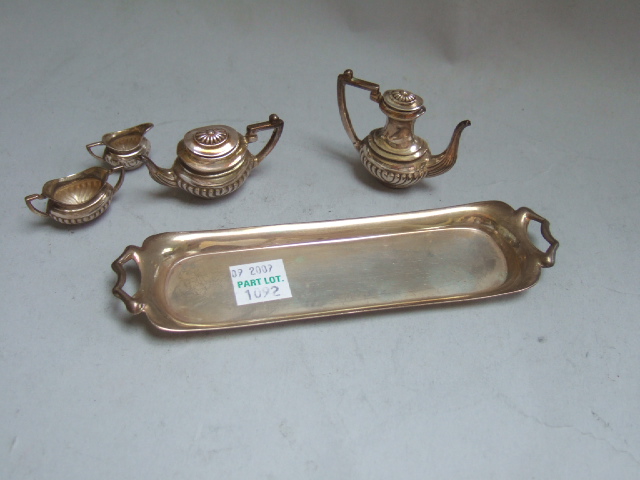 Appraisal: A silver miniature four piece tea and coffee set each