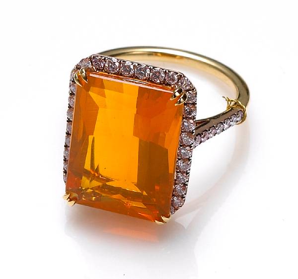 Appraisal: A fire opal and colored diamond ring centering a rectangular-cut