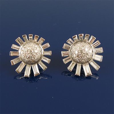 Appraisal: A pair of diamond cluster earrings Each pav set with