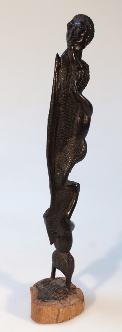 Appraisal: An African hardwood carved tribal figure group of three figures