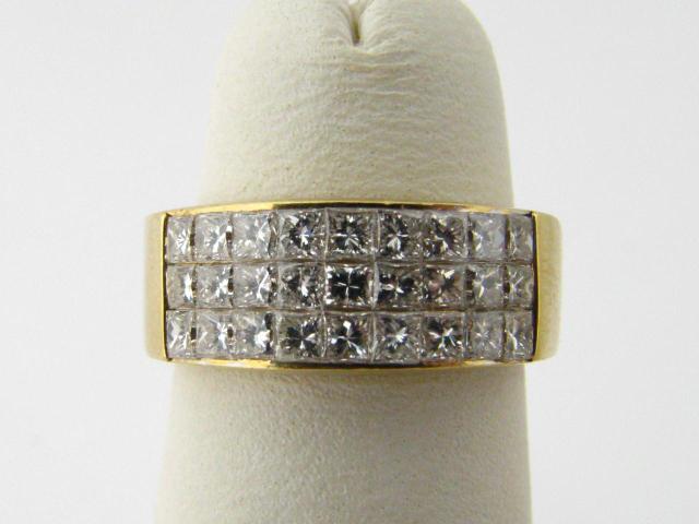 Appraisal: k yellow gold row invisible set diamond ring containing princess