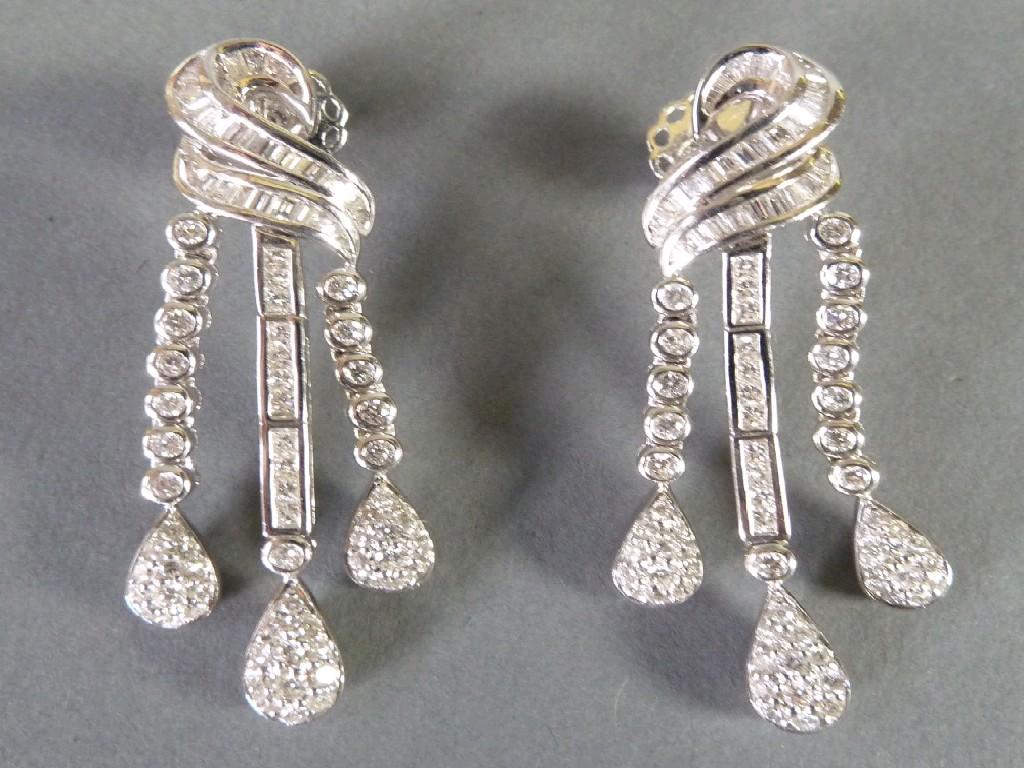 Appraisal: PAIR OF ct WHITE GOLD AND DIAMOND TRIPLE STRAND DROP