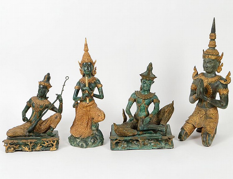 Appraisal: FOUR THAI GILT AND PATINATED BRONZE FIGURESComprising a three-piece garniture