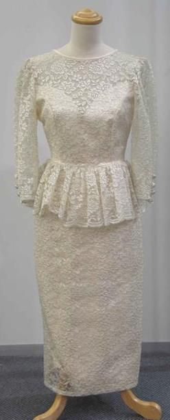 Appraisal: Cocktail dress in cream lace with peplum and deep back