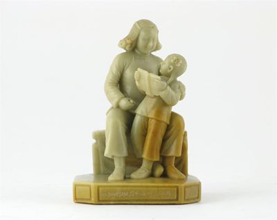 Appraisal: A Chinese soapstone carving of a girl child reading to