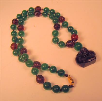 Appraisal: Chinese simulated jade and amber glass necklace th th century