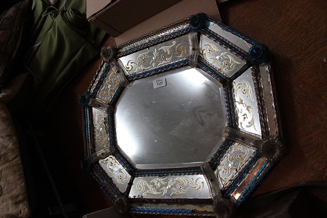 Appraisal: A VENETIAN OCTAGONAL WALL MIRROR the central bevelled mirror plate