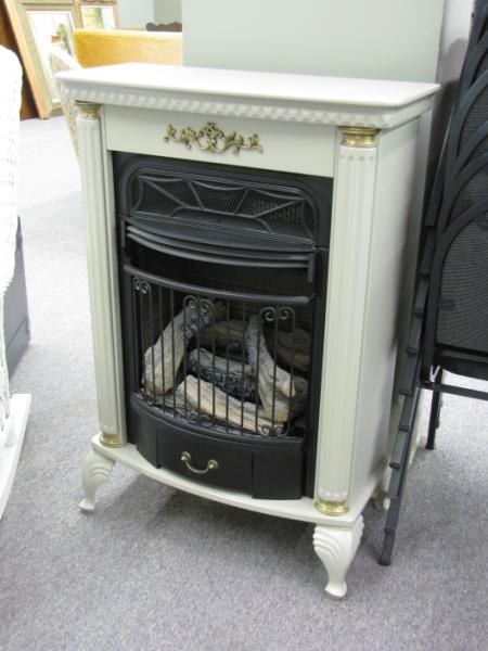 Appraisal: Freestanding Gas Fireplace with cast metal surround beige