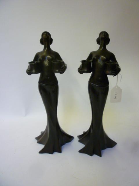 Appraisal: A PAIR OF FRENCH ART NOUVEAU BRONZE FIGURAL CANDLESTICKS modelled