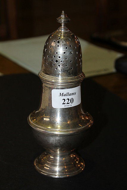 Appraisal: A GEORGIAN STYLE SILVER CASTER of baluster form on pedestal