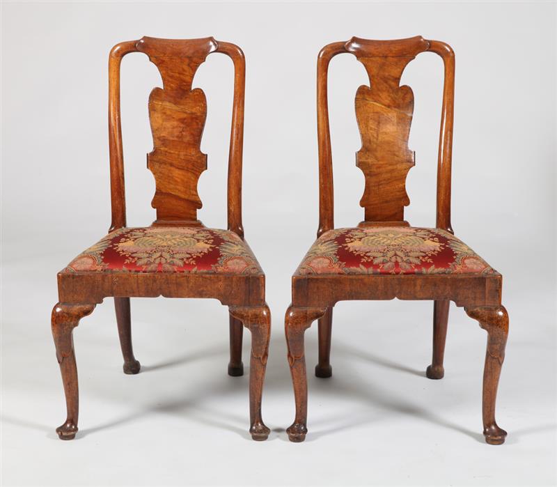 Appraisal: PAIR OF GEORGE I WALNUT ARMCHAIRS Each with a molded