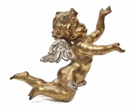 Appraisal: A Carved Giltwood Winged Putto depicted in flight with a