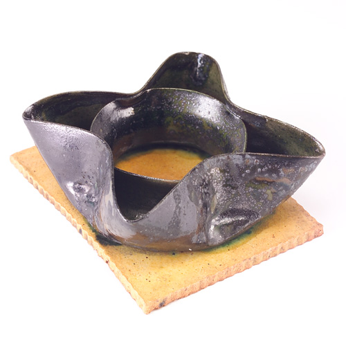 Appraisal: GEORGE OHR Ashtray matchholder with floriform top in mottled gunmetal