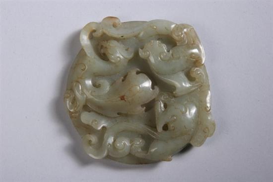 Appraisal: CHINESE CELADON JADE BI Ming dynasty Carved in high relief