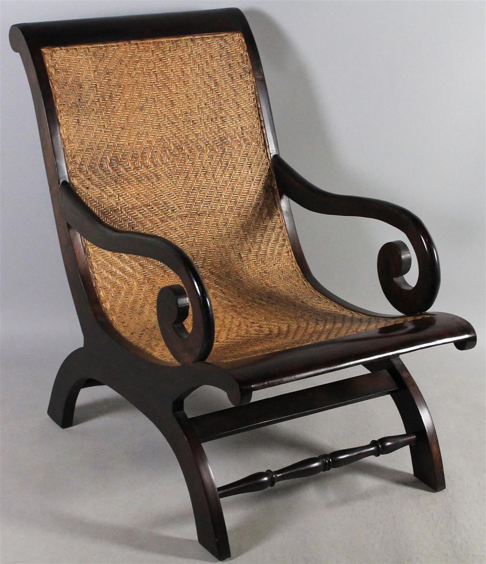 Appraisal: JAVANESE WOOD AND CANE PLANTATION CHAIR having a hardwood frame