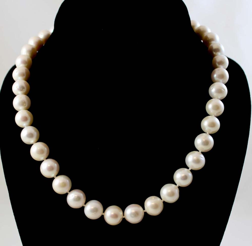 Appraisal: PRINCESS LENGTH PEARL AND FOURTEEN KARAT GOLD NECKLACE The hand-knotted