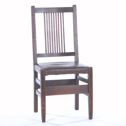 Appraisal: GUSTAV STICKLEY Sidechair with a spindled back and a tacked-on