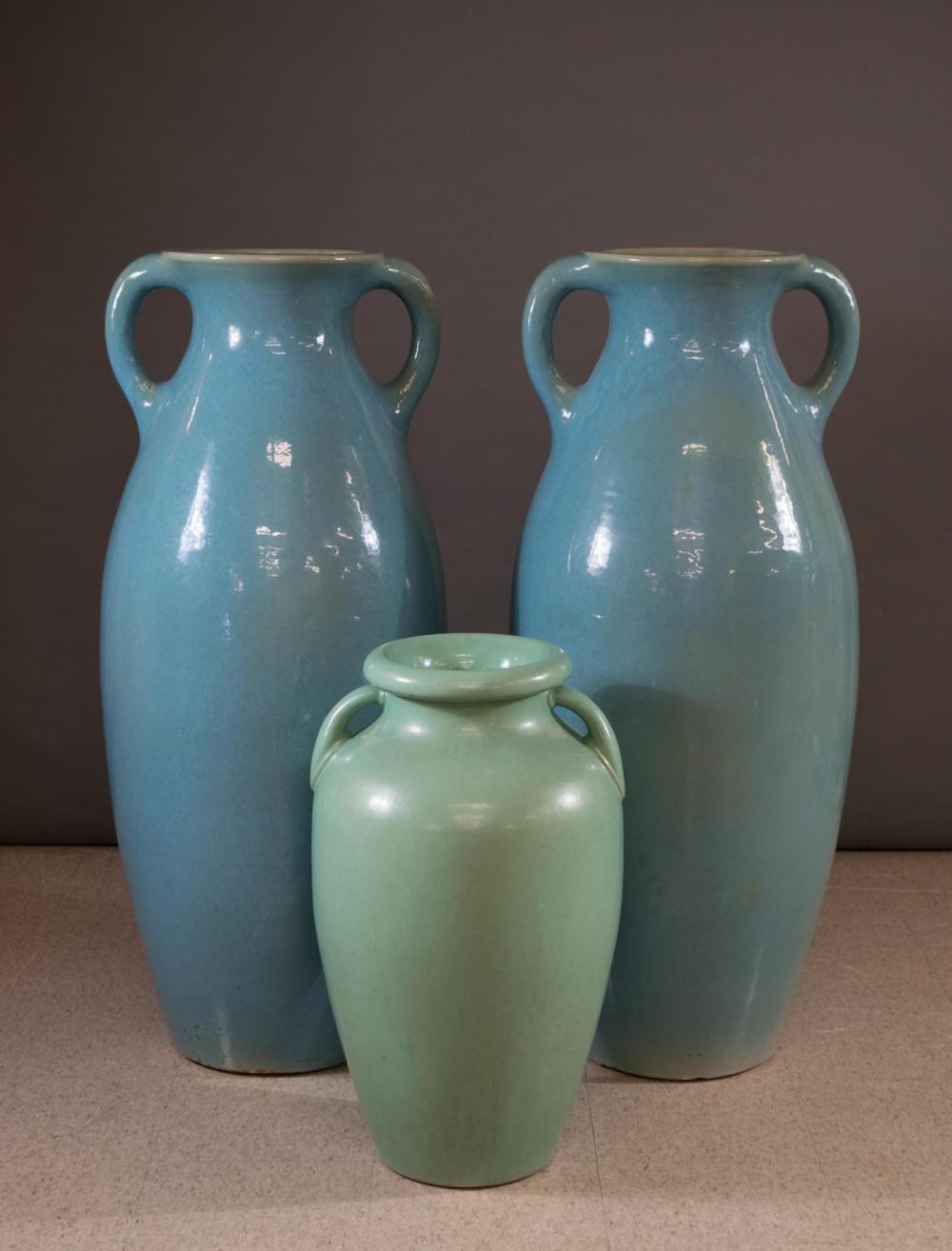 Appraisal: THREE LARGE GLAZED POTTERY TWO-HANDLE FLOOR VASES H turquoise glaze