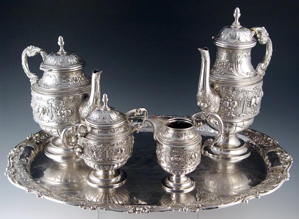 Appraisal: PIECE GERMAN SILVER REPOUSSE TEA SET Repousse designs of fruits