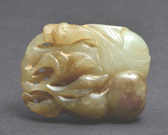 Appraisal: A CHINESE CARVED GREY AND WHITE JADE PENDANT peach and