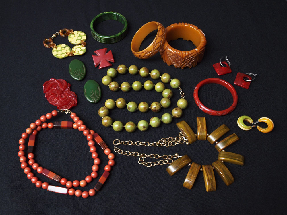 Appraisal: RED BUTTERSCOTCH AND GREEN BAKELITE PLASTIC JEWELRY carved bracelets red