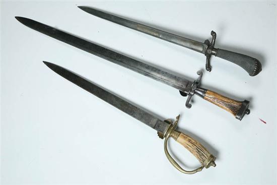 Appraisal: THREE HUNTING SWORDS Germany late th-early th century All have