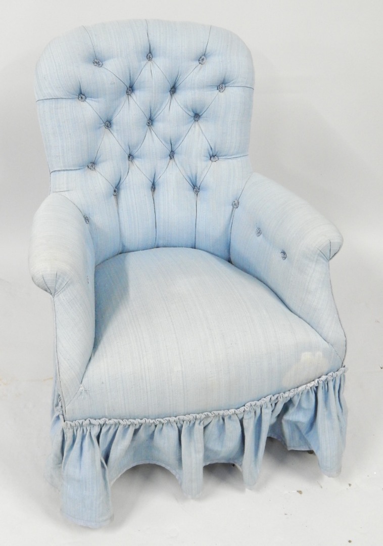 Appraisal: A Victorian mahogany spoon back armchair upholstered in turquoise button