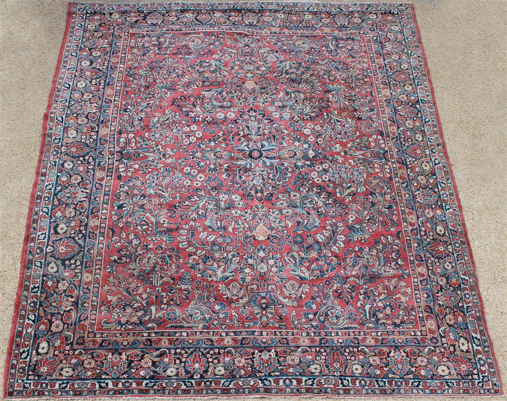 Appraisal: PERSIAN SAROUK WOOL RUG floral sprays on a deep rose