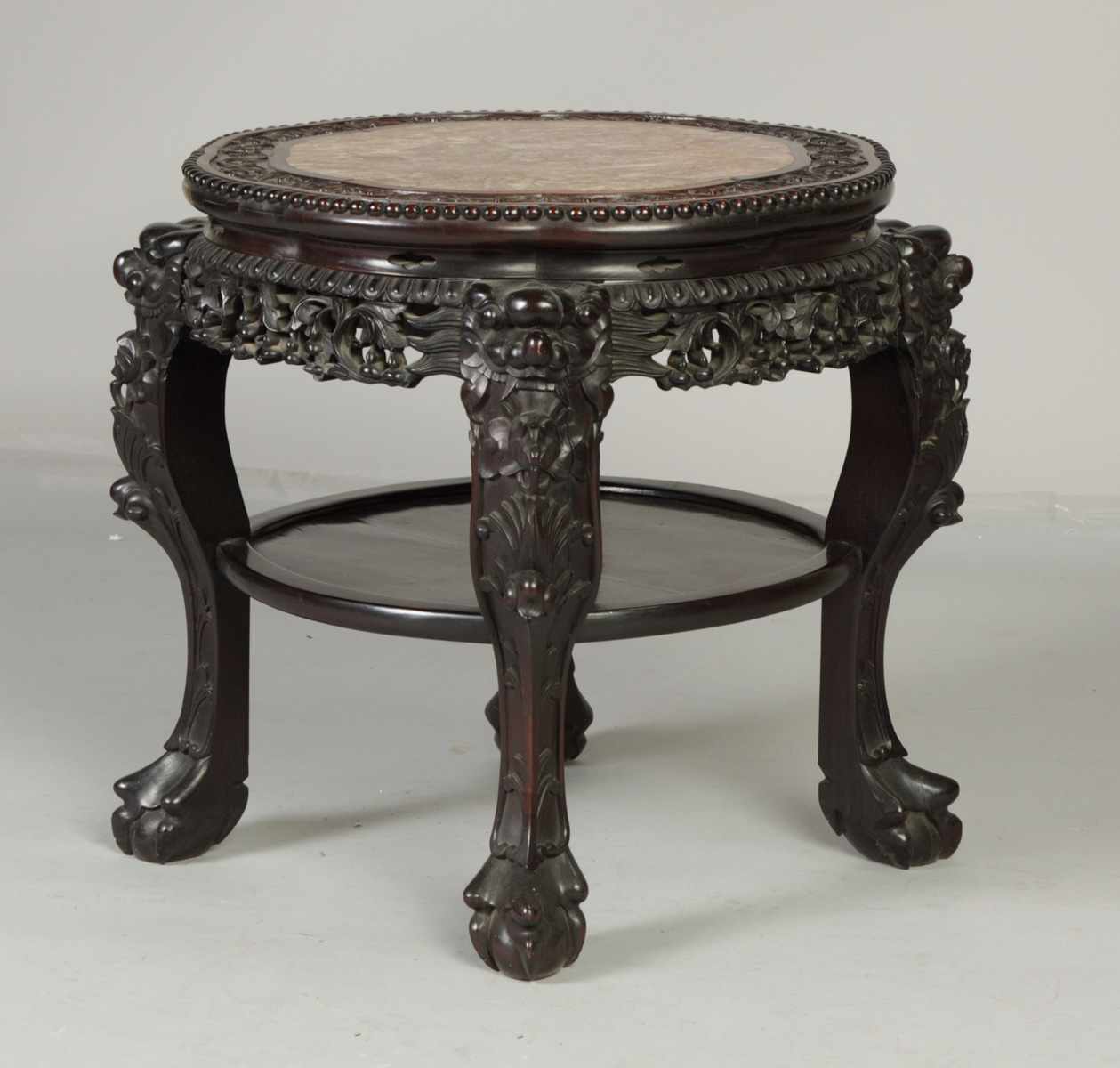 Appraisal: Chinese Carved Hardwood Stand with Marble Top Stylized foo dog