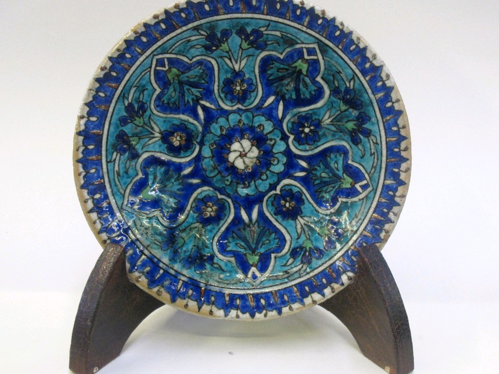 Appraisal: Persian pottery dish decorated with flowers in blue glazes