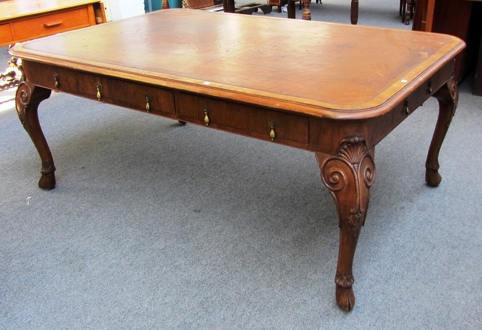 Appraisal: An early th century walnut library table by Maple Co