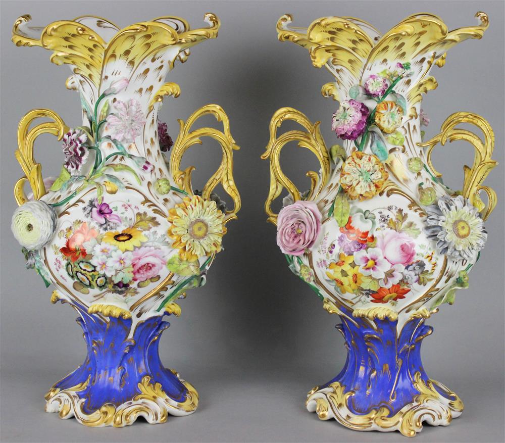 Appraisal: PAIR OF ENGLISH PORCELAIN FLOWER ENCRUSTED TWO-HANDLED VASES ca s