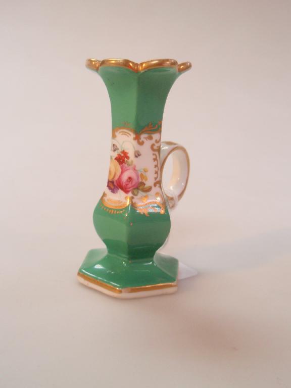 Appraisal: A thC porcelain taper stick with ring handle of hexagonal