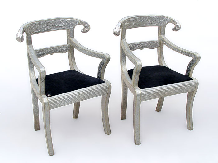 Appraisal: ART DECO STYLE EGYPTIAN TOOLED METAL RAMS HEAD ARM CHAIRS