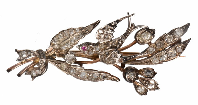 Appraisal: A DIAMOND AND RUBY SET SWALLOW BROOCH set with old