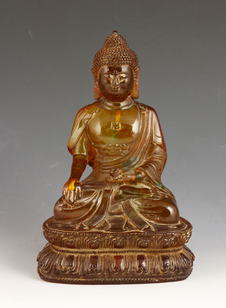 Appraisal: - Chinese Carved Amber Type Buddha Chinese carved figure of