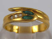 Appraisal: An carat gold emerald and diamond snake ring size L