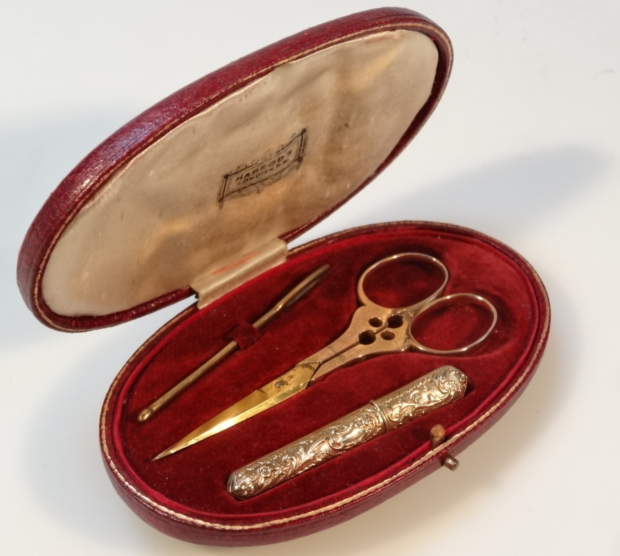 Appraisal: An early thC Harrod's cased etui the oval tooled case