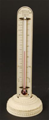 Appraisal: A th century ivory desk thermometer with an ornamentally turned