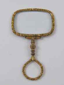 Appraisal: A gilt metal Regency quizzing glass the glass x cm